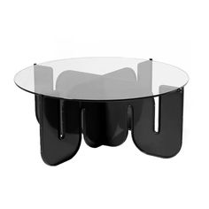 an oval glass table with two black legs