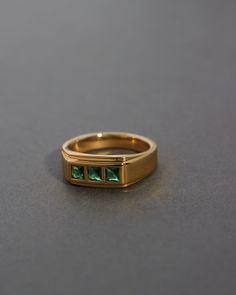 Vintage style statement ring featuring three square cut Emerald stones Ring is 7.5mm x 4mm Made from Brass with emerald stones Plated Gold Available in US ring size 4, 5, 6, 7, 8 100% nickel-free and cadmium-free 1 year warranty Packaged in Luv Aj branded gift boxes Formal Emerald Ring With Rectangular Stone, Formal Emerald Ring With Rectangular Shape, Formal Rectangular Emerald Ring, Gia Certified Square Cut Emerald Ring Gift, Formal Stackable Emerald Cut Emerald Ring, Rectangular Emerald Ring With Polished Finish For Anniversary, Classic Rings With Rectangular May Birthstone, Classic Three Stone Rectangular Rings, Modern Rectangular Emerald Ring For May Birthstone