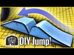 an open book sitting on top of a table next to a blue arrow and the words diy jump