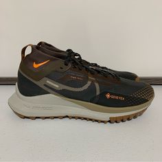 Nike React Pegasus Trail 4 Gore-Tex Sneaker Running Shoes -Size 6 Men’s (7.5 Women’s) -Anthracite/Light Mandarin/Iron Stone -Hit The Ground Running -Low-Profile Design -Pull Tab For Easy Entry -Lace-Up Fastening -Sock-Like Cuff -Signature Nike Branding -React Foam Midsole Provides Ultra-Responsive, Springy Cushioning -Durable Rubber Outsole -Shockwave-Like Pattern Tread -New With Tags -New Without Box Nike Brown Functional Sneakers, Nike Brown Low-top Running Shoes, Brown Functional Running Shoes With Boost Midsole, Brown Running Shoes With Boost Midsole, Functional Brown Running Shoes With Boost Midsole, Functional Brown Running Shoes With Round Toe, Sporty Brown Nike Running Shoes, Brown High-top Running Shoes, Functional Brown Lace-up Running Shoes