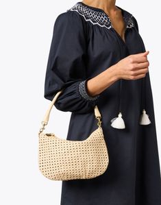 Clare V.'s Moyen bag is sure to be your new go-to. The messenger silhouette is crafted from woven rattan in a neutral cream hue and boasts stunning functional details like interchangeable shoulder and crossbody straps, and a roomy interior to hold all of your essentials. Style yours with ladylike dresses and sleek separates alike to effortlessly complete any look. On-the-go Natural Hobo Shoulder Bag, Chic Woven Leather Hobo Bag For On-the-go, Natural Satchel Straw Bag For On-the-go, Natural Straw Bag With Braided Handles For On-the-go, Natural Bags With Bamboo Handle For On-the-go, Natural Color Bags With Bamboo Handle For On-the-go, Modern Beige Straw Bag With Double Handle, Luxury Woven Cream Shoulder Bag, Chic Beige Woven Leather Bucket Bag