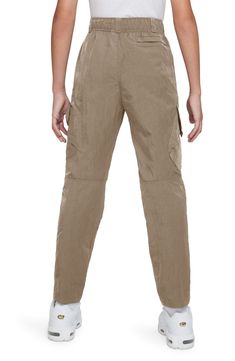 Lightweight woven nylon defines these adventure-ready cargo pants with articulated knees and an elastic snap waist for easy-on comfort. Elastic waist with snap closure Front welt pockets; back welt pocket; cargo flap-patch pockets 100% nylon Machine wash, tumble dry Imported Tactical Hiking Bottoms With Multiple Pockets, Tactical Parachute Pants For Outdoor With Pockets, Tactical Cargo Pants With Side Pockets For Outdoor, Tactical Hiking Pants With Cargo Pockets, Tactical Outdoor Bottoms With Side Pockets, Tactical Cargo Style Bottoms For Outdoor Activities, Tactical Parachute Pants For Outdoor Activities, Tactical Hiking Bottoms With Cargo Pockets, Tactical Cargo Pants With Cargo Pockets For Hiking