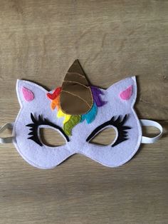 Unicorn children's mask in felt and shiny imitation leather. Elastic attachment. Children's Mask, Costume Masks, Leather Mask, Costume Mask, Costume Accessories, Felt, Mask, Elastic, France