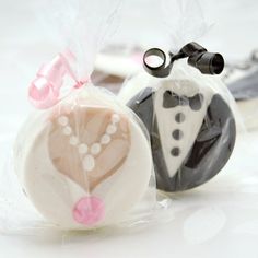 two wedding favors sitting on top of each other