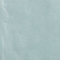 a blue leather textured surface with no visible lines or scratches on the bottom half