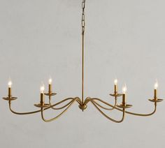 a chandelier with five candles hanging from it's arms and four lights on each end