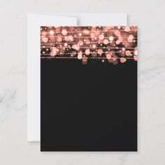 a black card with pink lights on it