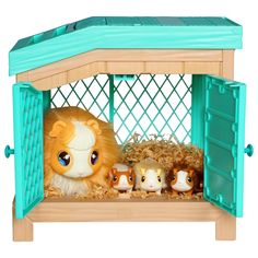 a toy hamster in a cage with other toys inside it on a white background