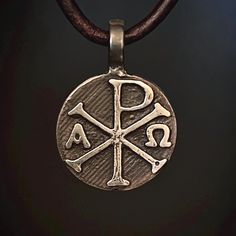 Beautiful, 100% pure silver Chi Rho pendant.  Nothing is pre-made and ready to ship, Everything is made to order, current wait time is 2-3 weeks. Thank you for your patience! I am a small business and get orders made as quickly as possible.  As the owner and artisan behind Valkyrie Steel in Bigfork, Montana, I take great pride in transforming raw materials into meaningful, handcrafted pieces. This Chi Rho pendant is crafted from fine silver, beginning its journey with a reverence for tradition a Hand Cast Pendant Jewelry For Anniversary, Artisan Engraved Cross Pendant Jewelry, Symbolic Hand-cast Jewelry, Spiritual Soldered Sterling Silver Jewelry, Spiritual Sterling Silver Soldered Jewelry, Hand Cast Bronze Sterling Silver Necklace, Hand-cast Round Amulet Jewelry, Bronze Hand Cast Sterling Silver Necklace, Hand Forged Antique Silver Jewelry As Gift