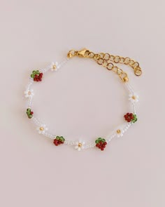 Pearl bracelet with white daisies and strawberries 🌸 The bracelet is hand-threaded with an elastic thread and a lot of love 🧡 The clasp made of allergy-friendly stainless steel means that the daisy bracelet can be pre-adjusted to any size. Since the rest of the bracelet is made with an elastic jewelry thread, it can still be easily put on and taken off over the hand 🌸 Bracelet length: 14 - 19 cm Should the bracelet be a gift? https://www.etsy.com/de/listing/1339607075 Care instructions: So that you can enjoy your jewelry for a long time, please follow these care instructions: 🌸 Don't let your jewelry get wet 🧡 Do not bathe, sleep or exercise with the jewelry on 🐚 Please do not use perfumes Strawberry Bead Bracelet, Strawberry Bracelet, Silver Pearl Jewelry, Diy Beaded Rings, Daisy Bracelet, Bracelets Design, Elastic Thread, Diy Bracelets Patterns, Beads Bracelet Design