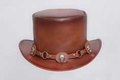 Description: * High-Quality Craftsmanship hand made * Real Leather * 100% pure leather **Those living in remote areas will have to pay $50 extra as shipping charges before the item is shipped. Sizing Heads come in all sizes, and in a lots variety of shapes. Although high quality hats are adaptable, and will usually conform to differences in shape with a little wearing, it is essential that the size be correct for the head. To determine your hat size, measure the circumference around your head, k Custom Handmade Leather Hat Bands, Steampunk Leather Brimmed Hat Bands, Festival Leather Hat Bands In Brown, Custom Handmade Brown Top Hat, Steampunk Leather Hat Band With Short Brim, Vintage Leather Hat With High Crown, Vintage Leather Hat Bands For Flat Crown, Vintage High Crown Leather Hat, Vintage Leather High Crown Hat