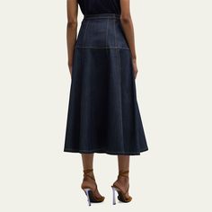 Cinq a Sept "Veena" skirt in dark-wash denim with contrast stitching  Three-pocket style  High rise Hem falls below the knee A-line silhouette Button front; belt loops  Polyurethane/viscose Lining: Cotton Dry clean Imported High Rise Skirt, Cinq A Sept, Denim Pencil Skirt, Denim Midi Skirt, Dark Wash Denim, Contrast Stitch, Contrast Stitching, Top Designers, Denim Skirt