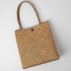 Handmade in Thailand by an artisan friend, this bag is perfect for the beach, the boat, the market, or the day. Size: 13”x5.5”. Made from all-natural jude. Please allow 6-8 weeks for delivery. Natural Fiber Shoulder Bag For Vacation, Eco-friendly Natural Shoulder Bag For Vacation, Natural Summer Shoulder Bag In Natural Fiber, Rectangular Palm Leaf Beach Bag For Travel, Eco-friendly Rectangular Natural Shoulder Bag, Casual Natural Handwoven Shoulder Bag, Natural Palm Leaf Beach Bag For Travel, Natural Fiber Summer Shoulder Bag, Casual Handwoven Beach Bag For Everyday Use