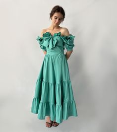 Cotton A-line Dress With Ruffles, Chic Cotton Midi Dress With Ruffles, Fitted Cotton Midi Dress With Ruffles, Chic Cotton Dress With Ruffled Skirt, Cotton Midi Dress With Ruffles, Spring Cotton Dress With Ruffled Skirt, Chic Green Dress With Voluminous Skirt, Cotton Dresses With Ruffled Skirt And Short Sleeves, Elegant Cotton Ruffle Dress For Spring