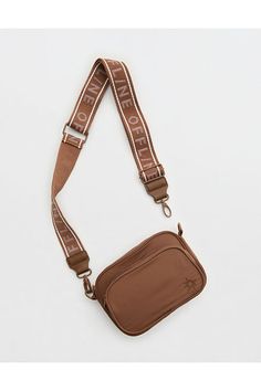 THE LOOK: Smooth, durable nylon./THE FEEL: Two compartments with zipper closure./THE MOVES: Your everyday, on-the-go routine./Accessibility deets: comfortable, adjustable strap designed with you in mind! Urban Outfitters Crossbody Shoulder Bag For Daily Use, Brown Nylon Crossbody Shoulder Bag, Urban Outfitters Everyday Shoulder Bag With Adjustable Strap, On-the-go Crossbody Shoulder Bag With Zipper Pouch, On-the-go Crossbody Bag Strap With Removable Pouch, Offline By Aerie, Women's Jeans, American Eagle Outfitters, Purse Wallet