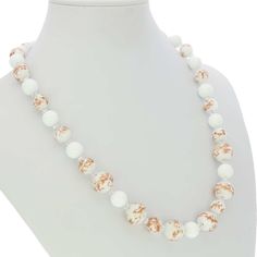 This gorgeous Venetian necklace in rich bright white color created by famous Murano glass masters in their tradition of artistic elegance and exquisite workmanship. It is is 100% hand-crafted using centuries-old Murano glass techniques. The necklace features beautiful rich color, and a combination of round beads of varying sizes infused with avventurina sparkles. Its festive bright look will light up your day and your mood. This Murano necklace is a must-have for any woman who values elegance, c Elegant Clear Single Strand Beaded Necklace, Elegant Single Strand Clear Beaded Necklace, Elegant Single Strand Clear Necklace, Elegant Round Glass Crystal Necklaces, Elegant White Crystal Necklaces With Round Beads, Elegant White Crystal Necklace With Round Beads, Formal White Single Strand Beaded Necklace, White Single Strand Beaded Necklace As Gift, Elegant Glass Beaded Necklaces