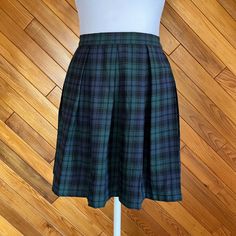 I'm Old Enough To Remember Getting The Delia's Catalog In The Mail To See The Latest Trends. Now You Don't Have To Wait To Get Your Hands On This Adorable And Timeless Plaid Mini Skirt. Whether You Want To Look Punk Or Preppy Or Dark Academia This Navy And Green Plaid Skirt Can Be Styled In So Many Ways! Condition: New Flaws: None Brand: Delia*S For Dolls Kill Materials: 100% Cotton Please Review Measurements Before Purchasing And Feel Free To Ask Any Questions. All Sales Are Final. Open To Reas Preppy Mini Length School Bottoms, Preppy Lined Mini Skirt For School, Green Lined Skirt Bottoms For School, Green Mini Length Skort For School, Preppy School Skirt Bottoms, Fitted Green Mini Skirt For School, Fitted Green Skirt For School, Preppy Pleated Skirt For School, Preppy Fitted Green Tennis Skirt