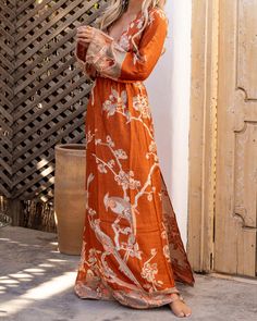 Indulge in the beauty of our Terra Dvau Maxi Dress, designed with a deep v cut and wide sleeves for a touch of elegance. Its eco-friendly modal fabric promotes mindful living, showing love for the planet while also standing out in style.Our modal is wearing size EU 34 | US 2 and her chest is 75 cm | 30 inch Orange Rayon Maxi Dress For Vacation, V-neck Maxi Dress For Brunch, Long Sleeve Viscose Maxi Dress For Summer, Summer Long Sleeve Viscose Maxi Dress, Flowy Maxi Dress With Side Slits For Spring, Spring Flowy Maxi Dress With Side Slits, Summer Long Sleeve Maxi Dress In Viscose, Relaxed Fit V-neck Maxi Dress For Brunch, Orange Tunic Maxi Dress For Spring