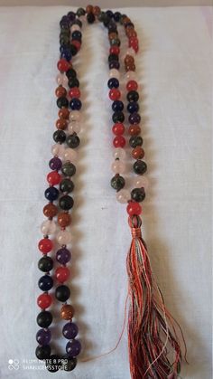 108 Beads/ Natural jade multi Colour Gemstone Japa Mala Prayer Beads multi colour Round Beads Japa Mala Guru beadr Beads semi-precious Gemstone Round Beads // Long Tassel Necklace// Meditation japa mala // Guru bead// Necklace Yoga Beads multi Color // 8 mm Bids size - 8mm approx It is known as the 'love stone' as the message it emits is the strong vibration of unconditional love, joy, warmth and healing. As quartz crystals are profound amplifiers of energy, it may help to kindle happiness, love Hand-strung Multicolor Beads For Gifts, Bohemian Multicolor 8mm Beads, Bohemian Multicolor Beaded Necklace, Multicolor Beaded Bracelets With Natural Stones For Healing, Multicolor Natural Stones Beaded Bracelet For Healing, Adjustable Multicolor Gemstone Beaded Necklaces, Multicolor Hand-strung Beaded Necklaces With Oval Beads, Spiritual Multicolor Beaded Bracelets, Traditional Multicolor Beaded Bracelets With Natural Stones