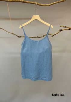 "Adorable camisole top by Nature Chic. 100% linen construction, this slip top is simply the best. Relaxed fit, straight cut, adjustable spaghetti straps, and classic scoop neckline, all these elements work together to create a versatile essential top. It is not only good for summer but also nice for fall underneath a shirt or jacket. -Prewashed linen -Straight cut but roomy -Scoop neck ( V neck's listing is below): https://www.etsy.com/listing/892733834/made-to-order-linen-camisole-top-v-neck?re Summer Scoop Neck Camisole With Built-in Bra, Summer Camisole With Built-in Bra And Scoop Neck, Solid Linen Sleeveless Tank Top, Sleeveless Linen Tank Top, Solid Color Linen Sleeveless Tank Top, Linen Tank Top For Vacation, Solid Camisole Tank Top For Vacation, Solid Color Camisole Tank Top For Vacation, Solid Summer Camisole