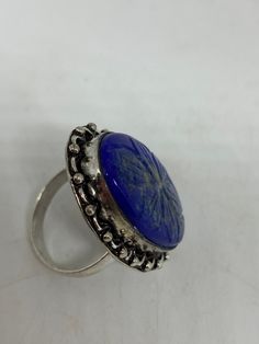 Large genuine blue Lapis Lazuli Vintage ring Flower hand carved Low content silver not sterling. Size 9 Can be re sized. My jeweler charges $10-$20 All rings are shipped in a nice gift box. Check out our over a THOUSAND great reviews Engraving is $4 per letter and is not always perfect depending on the piece. It can take a few days if the jeweler is busy. This is payable to Paypal Judithsltd@gmail.com Unique Carved Rings As Gifts, Unique Carved Rings For Gifts, Adjustable Carved Jewelry For Anniversary, Unique Carved Round Rings, Blue Gemstone Flower Ring Gift, Unique Blue Engraved Jewelry, Gift Blue Gemstone Flower Ring, Artisan Carved Ring As Gift, Artisan Carved Ring As A Gift