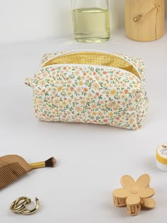 "This cute and floral makeup bag will help you in many ways. You can put your makeup in this toiletry bag when you are at a party or out. You can make a loved one happy by gifting it to a friend. If you are going to travel, you can put your cosmetic bag in your suitcase and prevent your make-up materials from being messy.You can use it as a pencil case when going to school.🌸 🧺Materials: Cotton fabric is used in the outer and inner fabric. There is a fiber fabric between the two, so we have a f Homemade Makeup Bag, Cute Rectangular Zipper Pouch For Cosmetics And Toiletries, Cute Rectangular Cosmetic And Toiletry Zipper Pouch, Cute Everyday Cosmetic Bag With Zipper, Quilted Makeup Bag Pattern, Cute Rectangular Cosmetic And Toiletry Storage Gift, Cute Multicolor Everyday Cosmetic Bag, Quilt Pencil Case, Cute Cosmetic And Toiletry Pouch For Daily Use