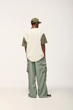 Elevate your streetwear with our Jet Cargo Pant. Vintage-inspired design, made from polyester and nylon, featuring midweight fabric and drawstring closure. SPECIFICATIONS Material: Polyester, Nylon Thickness: Midweight Waist Type: Mid Decoration: Pockets Closure Type: Drawstring Fabric Type: Broadcloth Cargo Pants Street Style, Parachute Cargo Pants, Dance Sports, Sportswear Collection, Parachute Cargo, Streetwear Pants, Aesthetic Streetwear, Oversized Outfit, Pant Trends