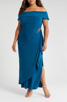 Make it a memorable evening in this elegant shoulder-baring gown styled with pretty draping and a sparkly waist embellishment. 53 1/2" length Hidden back-zip closure Off-the-shoulder neck Short sleeves Full-length column skirt Partially lined 96% polyester, 4% spandex Dry clean or hand wash, dry flat Imported Dresses Pre-draped Satin Finish Draped Evening Dress, Pre-draped Asymmetrical Hem Evening Maxi Dress, Column Skirt, Alex Evenings, Column Gown, Deep Teal, Off The Shoulder, Full Length, Short Sleeves