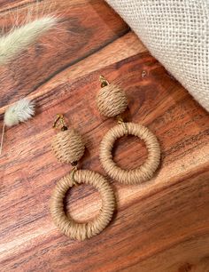 Elevate your boho chic style with these stunning natural hemp hoop dangle earrings. Measuring approximately 3.5 inches (8.9 cm) in length, these earrings are meticulously handcrafted with earthy brown and khaki-colored hemp, accented by 4mm tigers eye gemstones. The elegant gold plated leverback closures add a touch of glamour to these rustic and nature-inspired earrings.Materials:Natural Hemp: These earrings feature natural hemp cord in earthy brown and khaki hues, adding a touch of rustic char Hemp Cord, Free Spirit Style, Tigers Eye Gemstone, Boho Chic Fashion, Rustic Design, Tiger Eye, Rustic Charm, Statement Pieces, Boho Chic