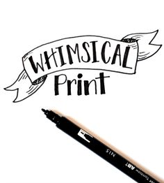 a black marker pen sitting on top of a piece of paper that says whimsical print