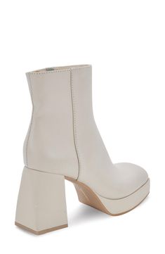 A flared heel and chunky platform bring a boost of glam to a side-zip bootie designed in clean monochrome. 4" heel; 2" platform Leather upper/synthetic lining/rubber sole Imported Chunky Platform, Bootie, Side Zip, Nordstrom Rack, Rubber Sole, Ankle Boot, Leather Upper, Nordstrom, Bring It On