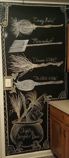 a chalkboard wall in a kitchen with spices and herbs drawn on the back of it