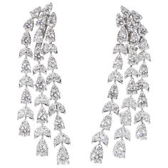 A stunning pair of earrings! Almost 7 carats of sparkle! 6.87 carats of round brilliant cut diamonds set in pear and marquise shaped 18k white gold. The round stones give the earrings more sparkle and a unique look. Approximately half an inch wide and 2 inches at its longest point Please contact us for more information. Pearl Chandelier Earrings, Diamond Chandelier Earrings, Gem Earrings, Diamond Dangle Earrings, Sparkle Jewelry, Expensive Jewelry, Diamond Drops, Antique Earrings, Lovely Jewellery