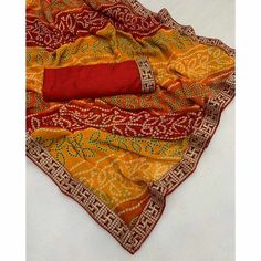 Red & Yellow color saree is made from georgette is highlighted with beautiful foil printed with printed with embroidered border work as shown. Comes along unstitched embroidered banglori silk blouse piece which you can customise as per your design/style. Occasion - You can wear this saree for festive and functions. Note:- The actual product may differ slightly in color and design from the one illustrated in the images when compared with computer or mobile screen. Measurements: Saree : Georgette Semi-stitched Bollywood Saree With Printed Border, Festive Bandhani Print Georgette Pre-draped Saree, Bandhani Print Pre-draped Saree For Puja, Festival Georgette Pre-draped Saree With Border, Bollywood Style Red Pre-draped Saree With Printed Border, Red Unstitched Saree For Navratri, Red Georgette Blouse Piece For Navratri, Festival Georgette Pre-draped Saree With Printed Border, Red Bandhani Print Unstitched Saree