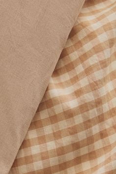 the fabric is brown and white checkered