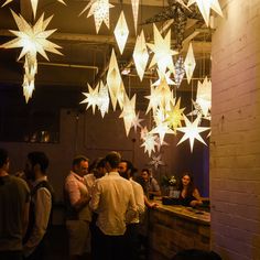 Our handpicked party pack of 8 paper lanterns is a quick and convenient way to add instant impact to your party venue on. Whether you’re planning a formal feast or a boho style ball, these celestial statement pieces will ensure you do it in style! Our selection of star lights covers a subtle spectrum of neutral tones from brilliant white, though pebble grey, and natural stone, creating a warm natural light. Hang in a cluster or group constellation to highlight a bar, chillout space, dining table Paper Star Decor, Lantern Display Ideas, Night To Shine Tim Tebow Decorations, Paper Decorations Wedding, Light Themed Party, Paper Star Lights, Paper Star Lanterns, Star Lantern, White Lampshade