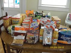 the table is full of snacks and condiments