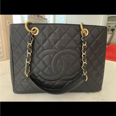 Chanel Handbag Authentic Vintage, Rarely Used. Large (13.5”Wx9.5”Hx4”D). 3 Compartments, One With Zipper. Comes With Original Certificate, Documentation, Cleaning Cloth (Unused), And Protective Storage Cover. Luxury Large Shoulder Bag With Removable Pouch, Large Black Luxury Bag, Large Luxury Black Bag, Large Black Designer Bag, Elegant Large Shoulder Bag With Detachable Handle, Elegant Large Shoulder Bag With Top Carry Handle, Large Elegant Black Bag, Elegant Large Black Bag, Elegant Large Black Shoulder Bag