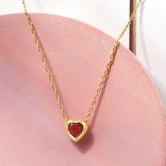 Ross-Simons - .30 Carat Garnet Heart Necklace in 14kt Yellow Gold. 18". RS Pure. Modern designs that complete your outfit and complement your personality. Romanticize everything in your life - even your layered looks. This dainty necklace will have you swooning, featuring a rich .30 carat heart-shaped garnet in a simple setting of 14kt yellow gold. Suspends from a rope chain with a 2" extender. Springring clasp, garnet heart necklace. Garnet birthstones are the perfect gift for January birthdays Fine Jewelry Heart Necklace With Birthstone For Formal Occasions, Formal Heart Necklace With Birthstone, Formal Heart-shaped Birthstone Necklace, Formal Heart Shaped Birthstone Necklace, Valentine's Day 14k Gold Pendant Necklace, Classic Heart-shaped Birthstone Necklace, Formal Heart Cut Birthstone Necklace, Valentine's Day Heart Pendant Jewelry With Polished Finish, Yellow Gold Heart Necklace With Gemstone