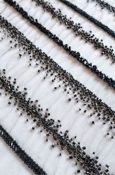 black beaded fabric with small beads on it