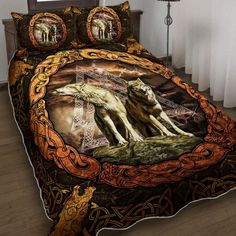 a bed with two wolfs on it and an orange chain around the comforter