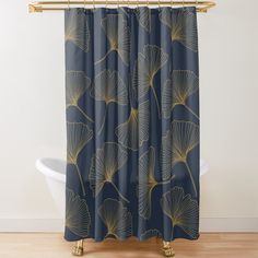 a blue shower curtain with gold leaves on it