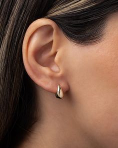 The perfect accessory for every occasion, these 14K Gold Small Teardrop Stud Earrings add a touch of luxury to any ensemble. From a strapless gown to a classic white tee, these earrings elevate your style with their curvaceous, bubbly design. Effortless and feminine, they are a trendy must-have for the fashion-forward woman. Size: Approx. 6mm(W) x 12mm(H) Total Weight: Approx. 1.37 grams (per pair) Standard Production: 2-5 business days Rush Order Production: 1-3 business days Shipping: Select s Elegant Teardrop Hoop Earrings With Polished Finish, Classic Teardrop Huggie Earrings For Wedding, Elegant Huggie Earrings For Wedding, Elegant Rose Gold Huggie Earrings For Formal Occasions, Classic Single Pear-shaped Earring, Classic Teardrop Huggie Earrings In 14k Gold, Classic Teardrop Huggie Earrings For Gift, Classic Teardrop 14k Gold Huggie Earrings, Polished Finish Hoop Earrings For Wedding