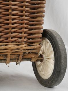 an old fashioned wicker cart with wheels