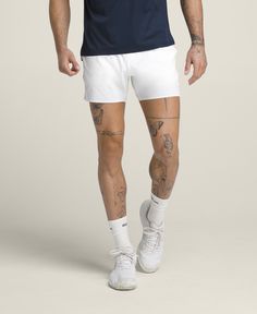 Sometimes it's not just about facing your opponent, but also the weather. The Tournament Short is Wilson's lightest-weight, on-court short for hot days. Ultralight and airy, the stretchy fabric is perforated for ventilation. The knit waistband has a mesh-like texture and a built-in drawcord, so it keeps a strong hold without feeling restrictive. Unlined and designed to pair with your favorite compression liner. | Wilson Men's Tournament Short 5" Breathable Fabric Athletic Shorts For Summer, Breathable Athletic Shorts For Summer, White Tennis Activewear With Built-in Shorts, Athleisure Athletic Shorts For Tennis In Summer, White Tennis Shorts Athleisure, White Shorts For Tennis Athleisure, White Athleisure Tennis Shorts, Summer Athletic Tennis Shorts, Summer Athleisure Athletic Shorts For Tennis