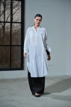 Elevate your summer wardrobe with our White Linen Oversized Kaftan, a stunning blend of elegance and comfort. Handmade from 100% pure, lightweight linen, this kaftan is OEKO-TEX® certified, ensuring that it's free from harmful substances. The relaxed fit drapes gracefully, complemented by a V-neck with a collar and buttons for a touch of sophistication. Long sleeves with cuffs and roll-up button tabs add versatility to your look, making it perfect for both beach vacations and urban adventures. D Lagenlook Long Sleeve Linen Tunic, Oversized Long Sleeve Linen Dress For Beach, Oversized Long Sleeve Linen Dress For Vacation, Bohemian Oversized Tunic Linen Dress, Oversized Bohemian Linen Tunic Dress, Oversized Bohemian Long Linen Dress, Oversized Linen Long Sleeve Tunic, Oversized Long Sleeve Linen Tunic, White Long Sleeve Relaxed Fit Kaftan