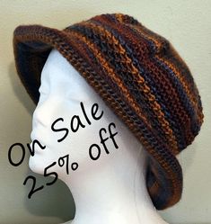 The Brim Beanie is made from Lionbrand Landscapes yarn which is 100% Acrylic and very soft.  The color is shades of blue and brown.  It is made lovingly in a smoke free home.  It is packable for travel or fun for wearing about town.  A good back to school item.  Care instructions are included. Hand or machine Wash, cool water. Dry Flat.  Do Not Iron.   Do Not Bleach. The hat will fit a head circumference of 20"-22" This hat is chemo friendly and made from a pattern by DROPS DESIGN. See other hats in my shop at https://somdesignsandco.etsy.com.  If you like our shop, please link to us at https://somdesignsandco.etsy.com on your favorite social media. Bohemian Knit Hats For Fall, Fall Bohemian Knitted Hats, Adjustable Brown Crochet Hat With Short Brim, Brimmed Crochet Hat For Outdoor One Size, Lightweight Brown Crochet Hat, One Size Fits Most, Lightweight Brown Crochet Hat, One Size, Crochet Hats For Fall, One Size, Lightweight Brown Crochet Hat, One Size Brimmed Crochet Hat For Outdoor