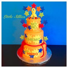 a three tiered cake with stars on it