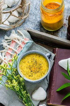 Top view of Golden Milk Latte served in a blue mug on a gray tray next to a glass jar filled with turmeric spice. Turmeric Latte Recipe, Turmeric Golden Milk, Golden Milk Recipe, Golden Milk Latte, Turmeric Milk, Turmeric Latte, Golden Milk