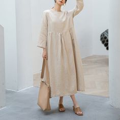 "Cool and comfortable for hot summer days, this natural linen dress is elegant and stylish.    It is a wonderful wardrobe staple that's a timeless classic you'll wear again and again.Pure natural linen materials, comfortable, breathable, refreshing and soft fabric. All our items are Tailored and Handmade and Made to Order ,I can make Any Size . I design new styles every week, please collect my store. I believe that you will meet your favorite styles. ★★FEATURES Linen 55% + Cotton 45% ( Medium Weight，Comfortable, Breathable and Washed Soft fabric) Two side pockets Round neckline 3/4 sleeve Pleated waist details Loose linen dress Casual dress Long linen dress Simple dress Perfect for Summer, Spring ★★Size Chart: ❤ Size chart is the garment's measurements, Not body measurements . Size S: Leng Cream A-line Linen Dress, Beige A-line Linen Dress For Spring, Spring Beige A-line Linen Dress, Beige Ramie Dresses For Spring, Long Sleeve Ramie Summer Dresses, Beige Relaxed Fit Midi Dress For Vacation, Spring Daywear Linen Dress, Spring Linen Dress For Daywear, Beige Relaxed Fit Summer Dress